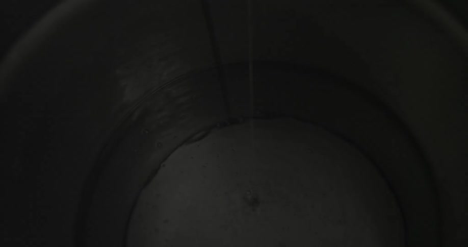 Water is pouring into a container