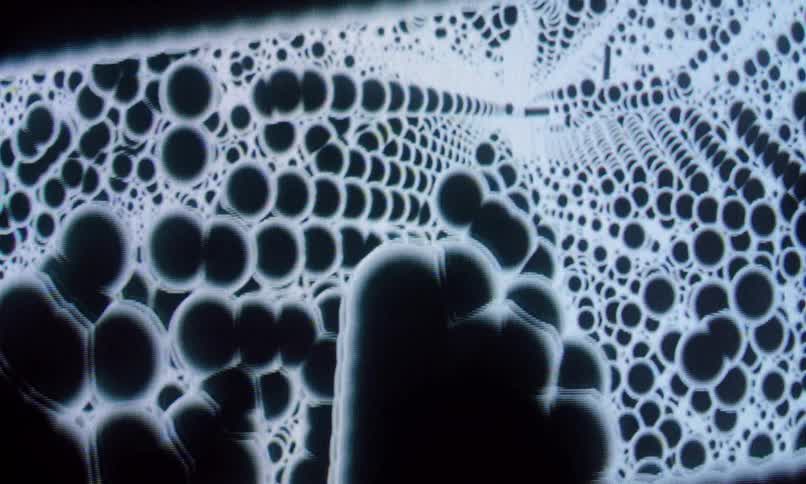 Threedimensional black dots against a white background