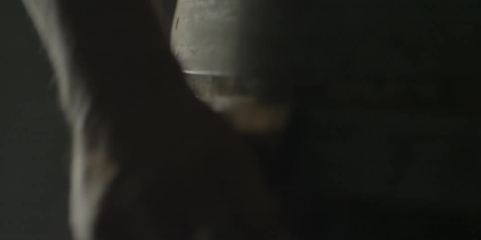 A person is adjusting the rings on a barrel