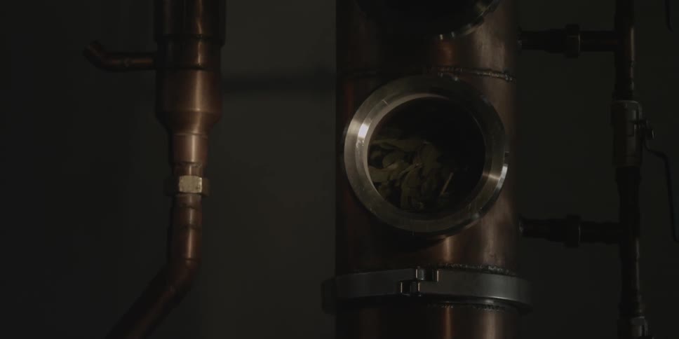A flashlight lights up a metal cylinder