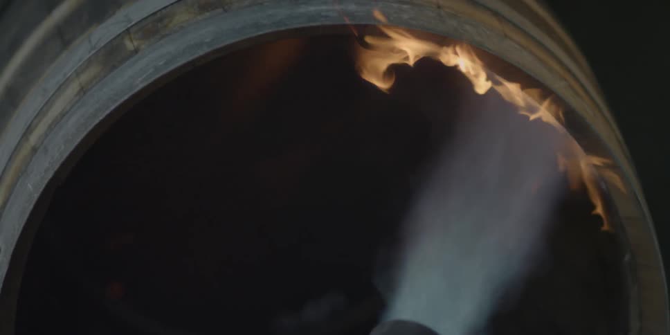 A torch is blowing fire in a barrel