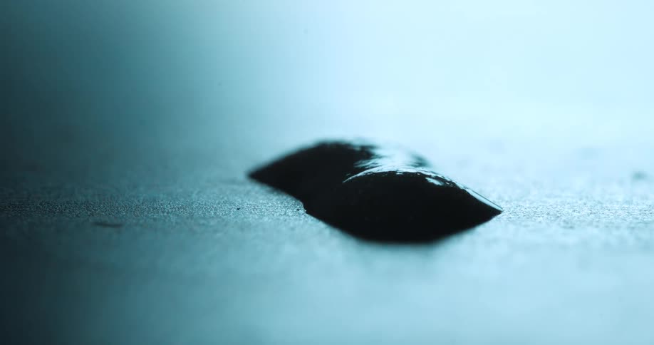 A footage of a substance on the black surface