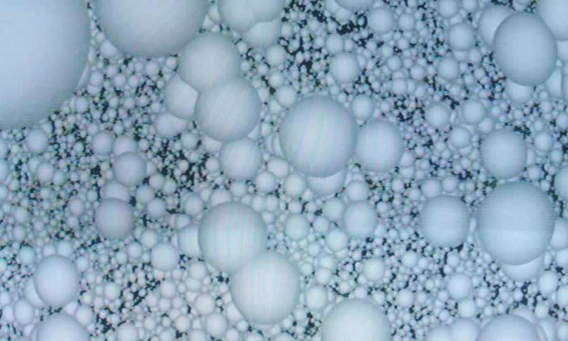 An abstract image of white falling bubbles