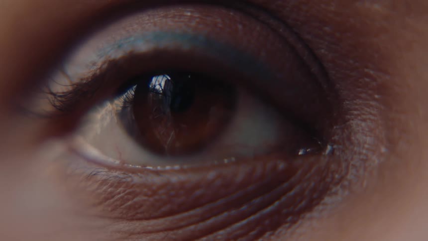Close up of a persons brown eye with soft makeup