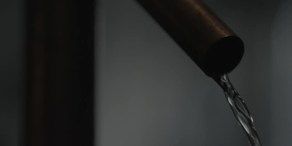 A nozzle slowly pours water