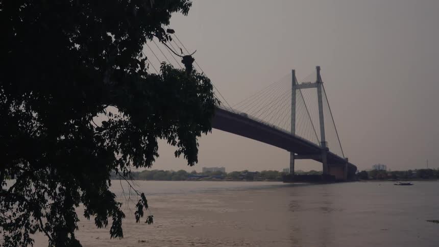 A bridge over water connects 2 areas of land