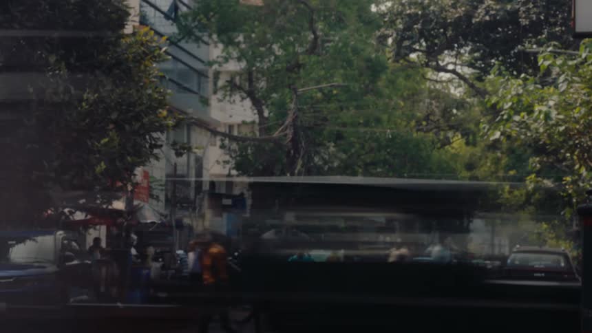 Traffic and people are traveling in the city