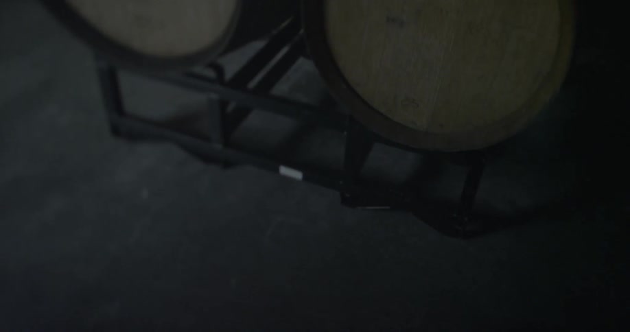 Barrels are on display in this dark room