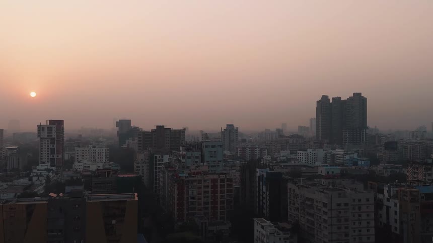 Aerial of metropolitan skyline at dusk