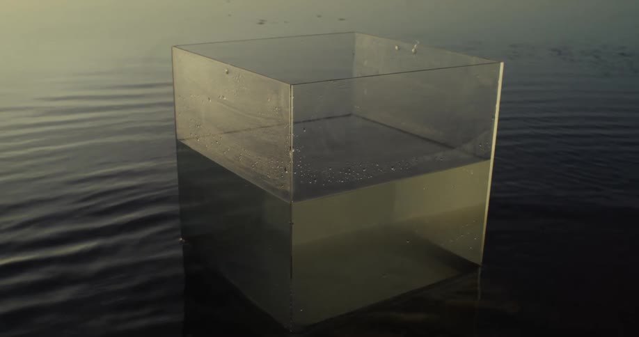 A plastic container is floating in the water