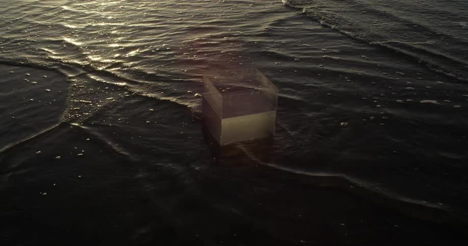 Transparent box in the shallow waters of the beach