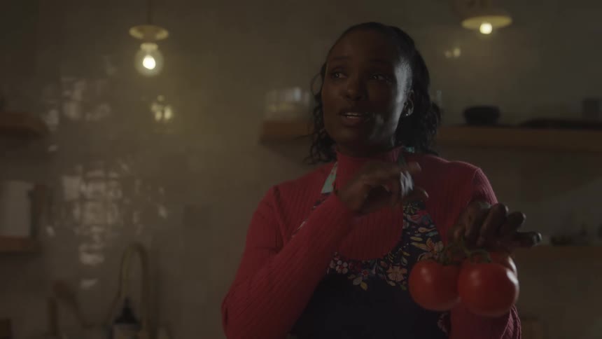 A woman is teaching cooking classes in her kitchen