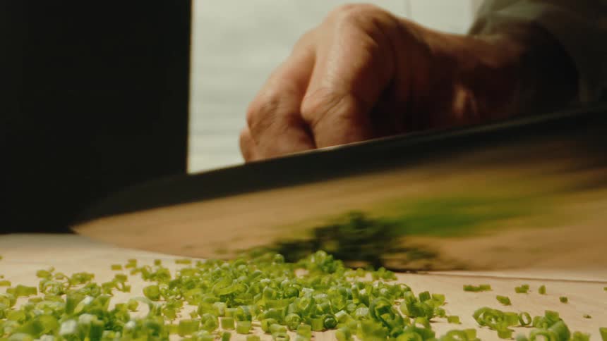 Chopping chives with a sharp chef knife