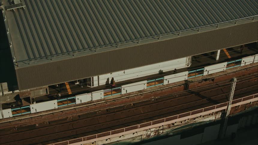 Top view of some people walking in a train station