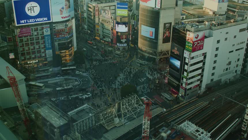 Famous tokyo intersection with vehicle and pedestrian traffic