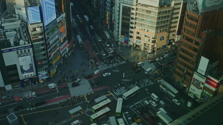Intersection of a tokyo metropolis with heavy vehicle and pedestrian traffic