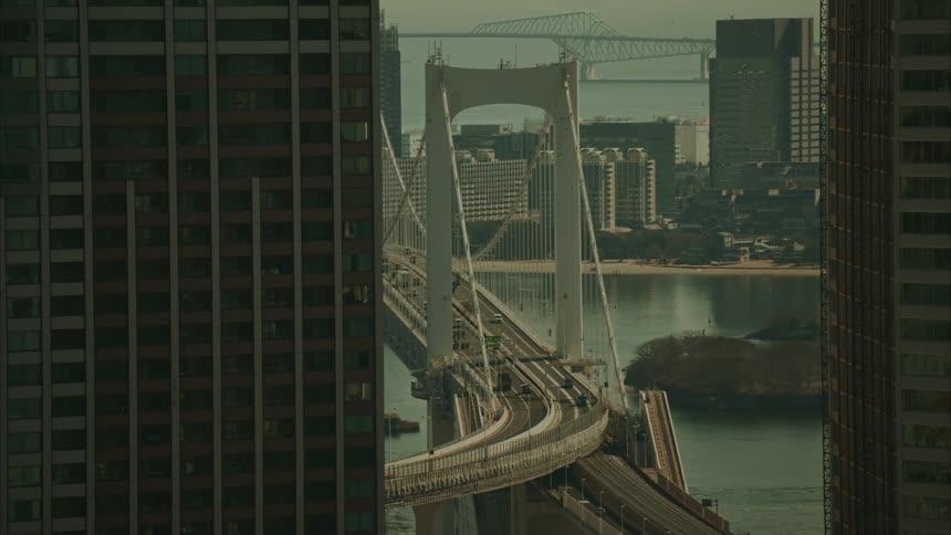 A bridge runs through the middle of a city