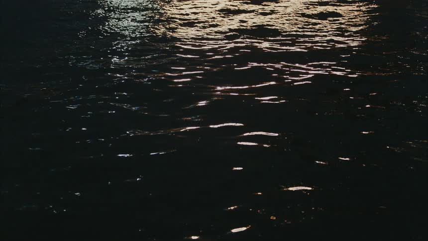 Soft ripples on the water with the sun reflecting off it