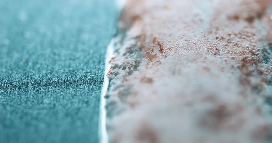 Clear liquid running down and turning into foam