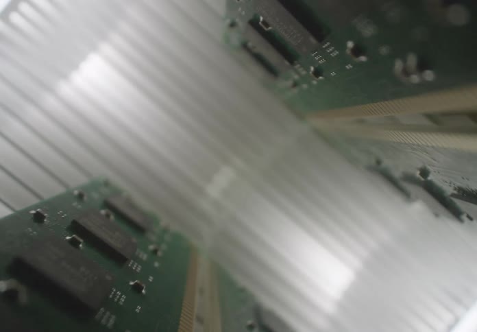 Electronic circuit boards are seen in perspective with a central blur effect