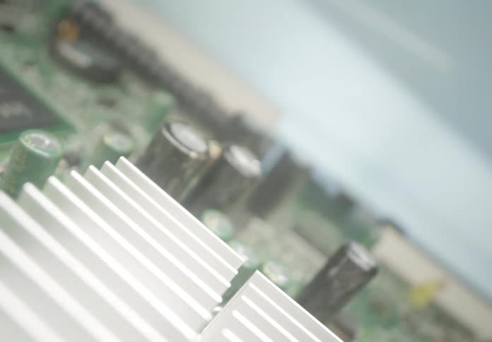 The computer board is covered with chips and transistors