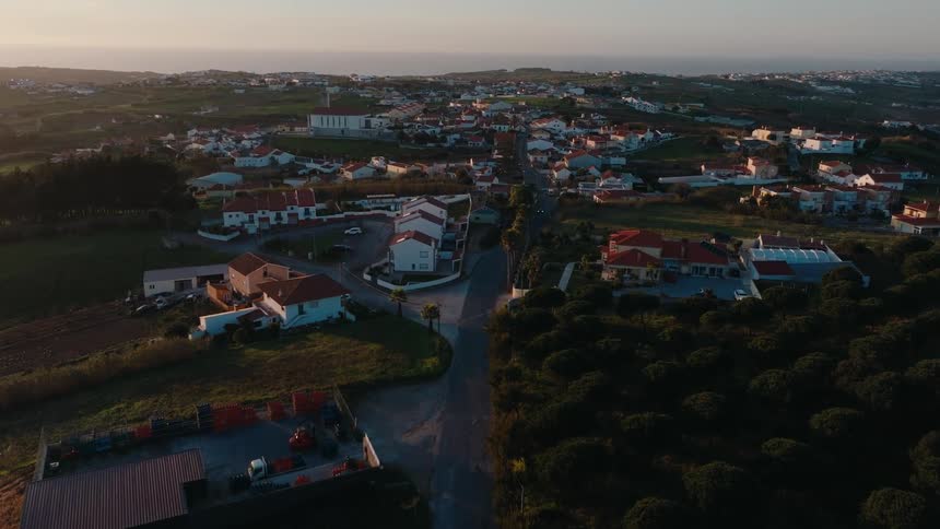 Aerial view of a suburb with the sea on the horizon