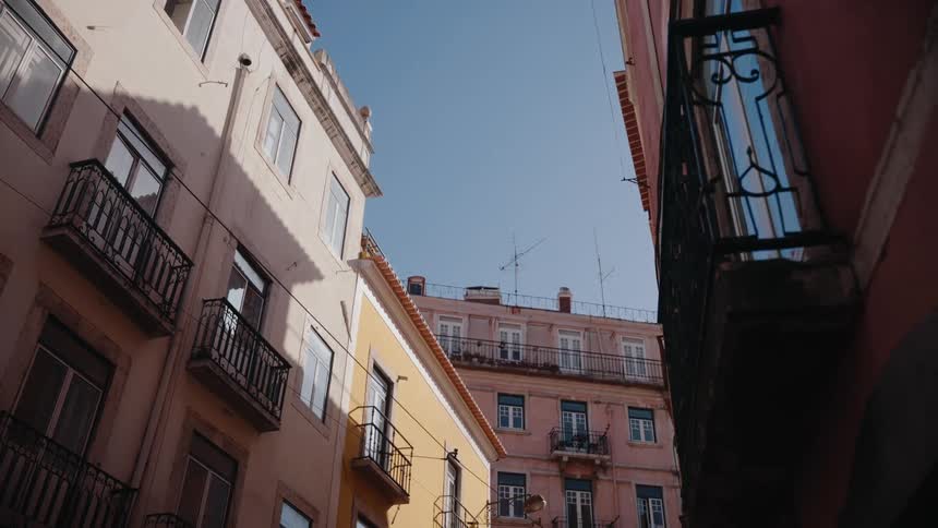The alley is filled with apartment buildings