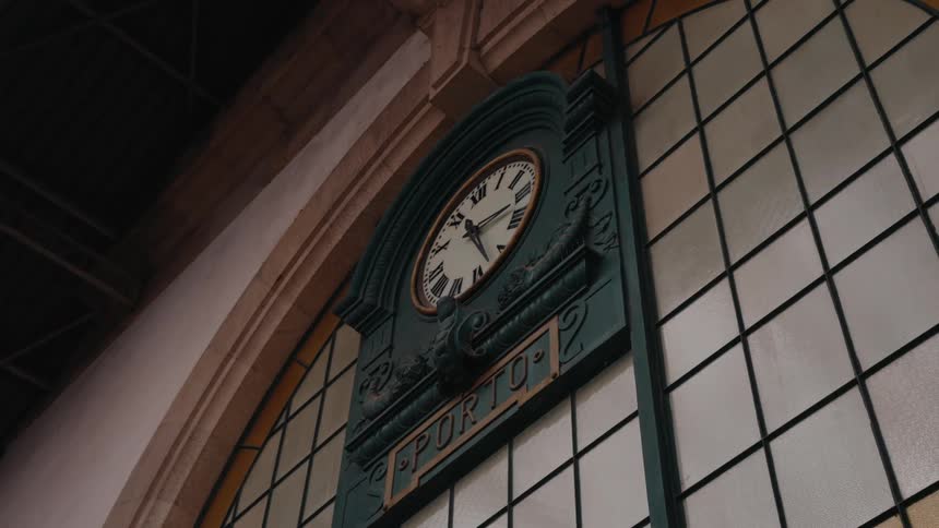 A clock is on the side of the building