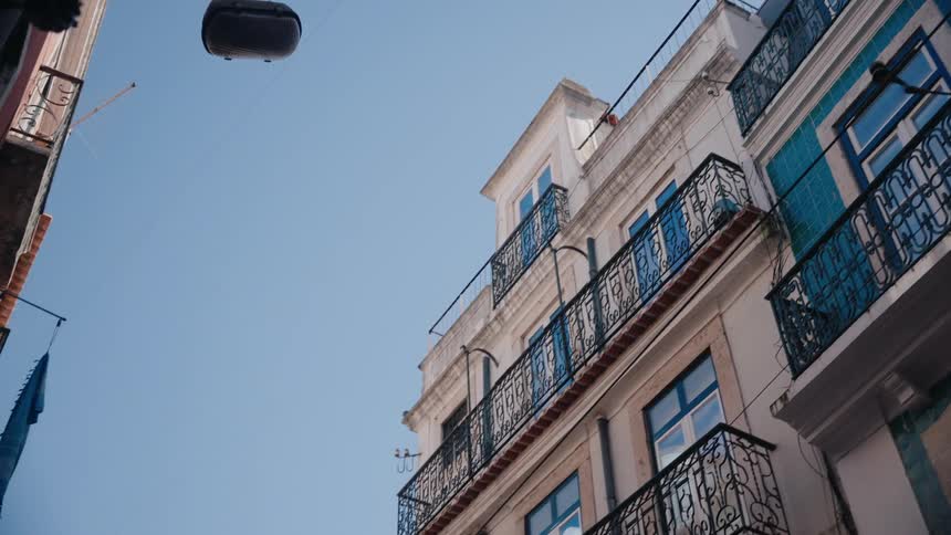 The apartment buildings in the city have balconies