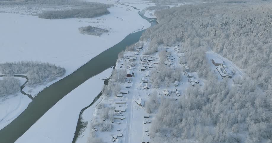 The town and landscape are covered in snow