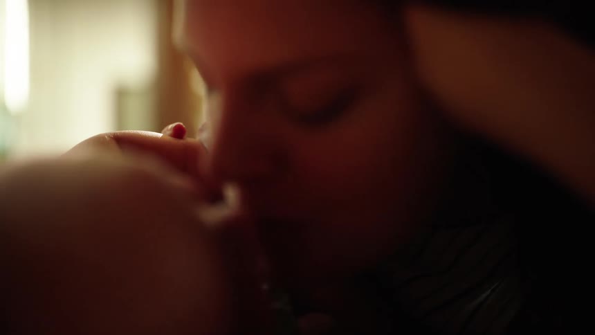 Portrait of a mother playing and interacting with her baby