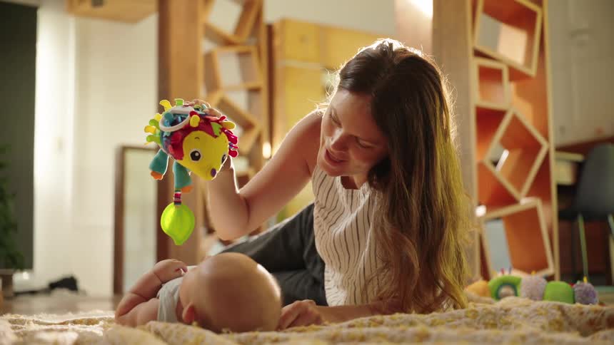 Mother playing with baby