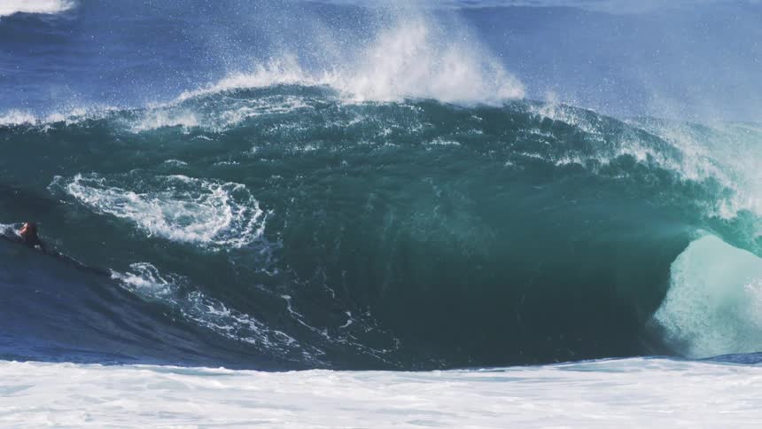 Surfer riding a tubular wave