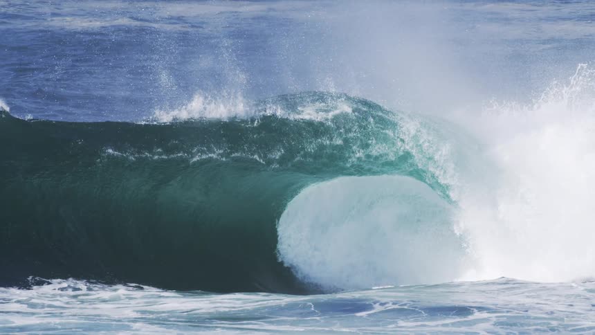 The large wave winds up and falls