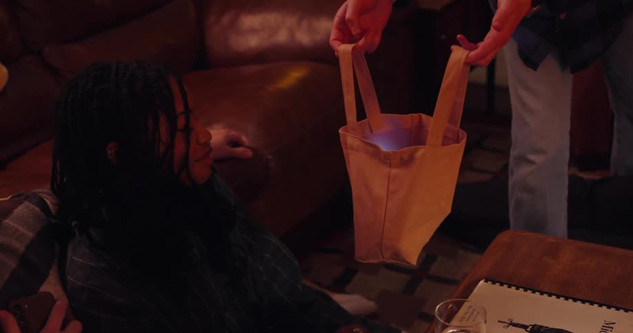 Friends all put their cell phone in a bag