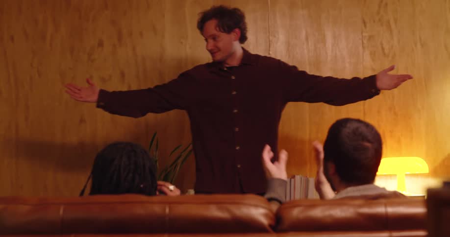 Friends in a living room playing charades