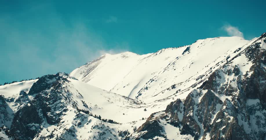 Snowcapped mountain against a blue sky