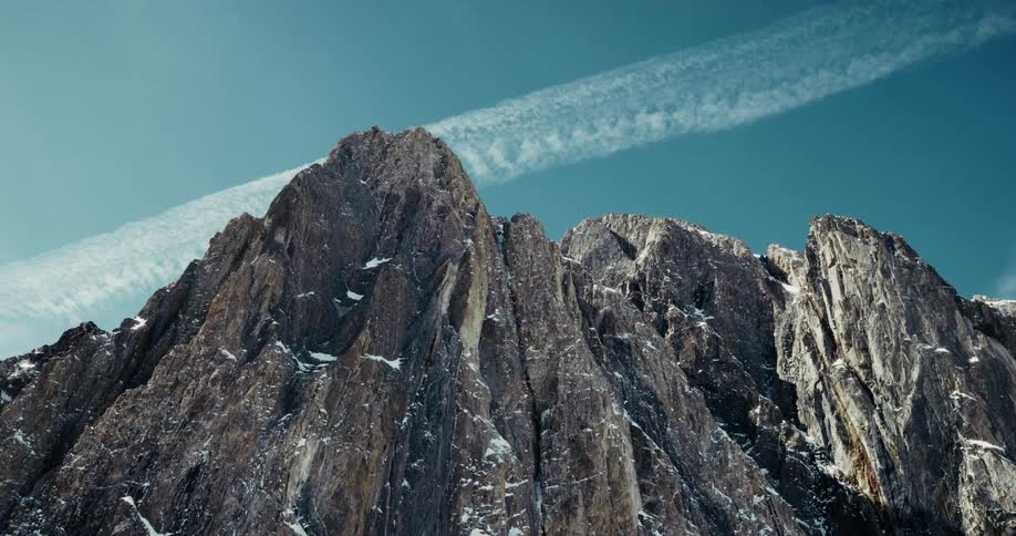 Mountain with rocky peaks and snowy cliffs