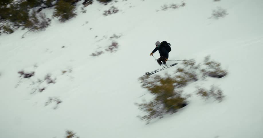 Person skiing down a snowy mountain