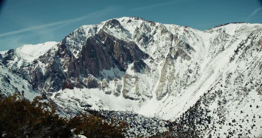 Scenery of snowcovered mountains with sparse vegetation