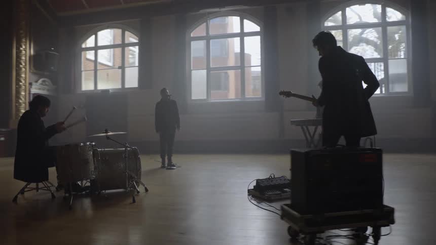The band perform in a circle