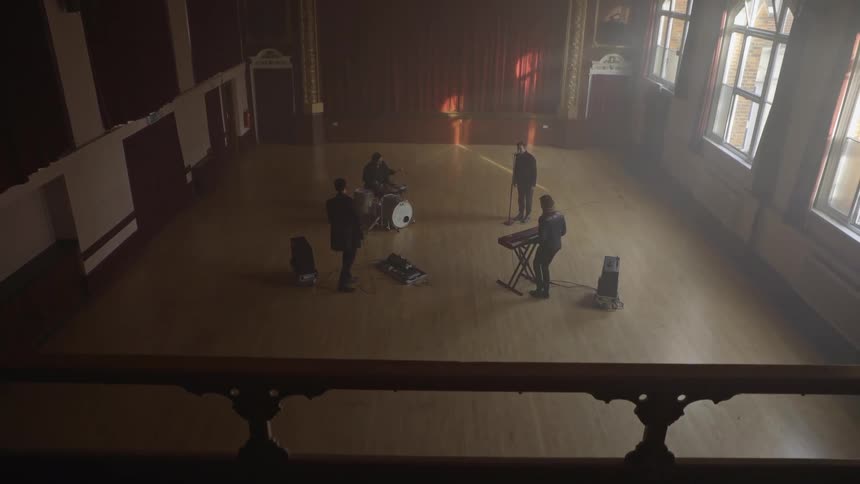 Musical group playing music in a hall during the day
