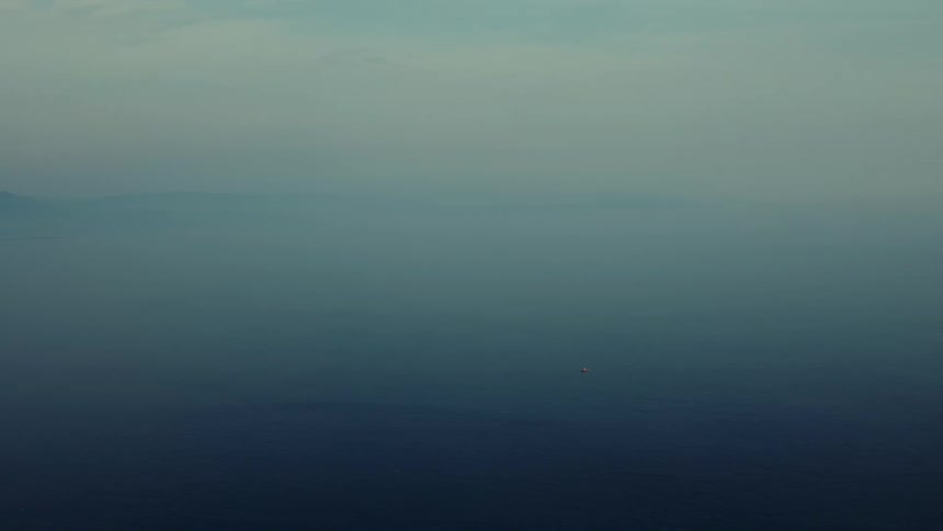 A blue sky meets the blue ocean