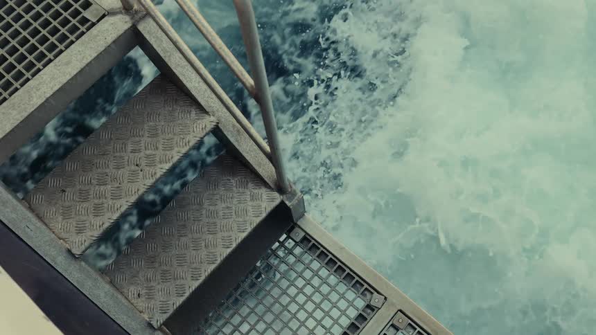 Water rushes beneath some stairs