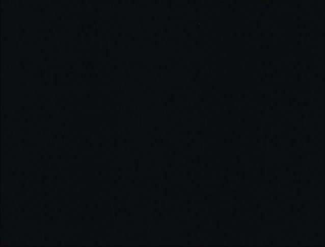 A child sitting on a chair with a flashing light and a shadow changing shape in a scary way