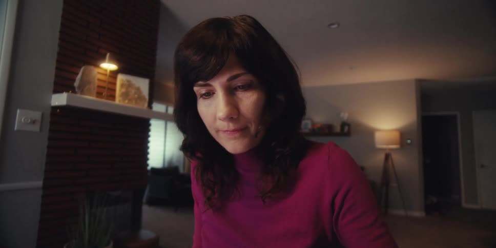 A woman is tapping on her tablet