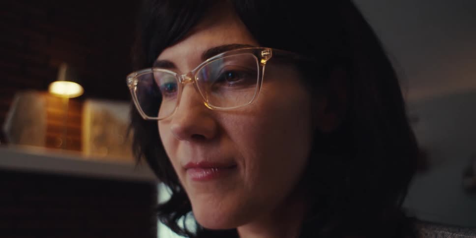 A close up footage of a lady typing on a computer