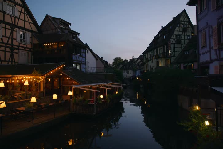 The homes reflect on the canal water