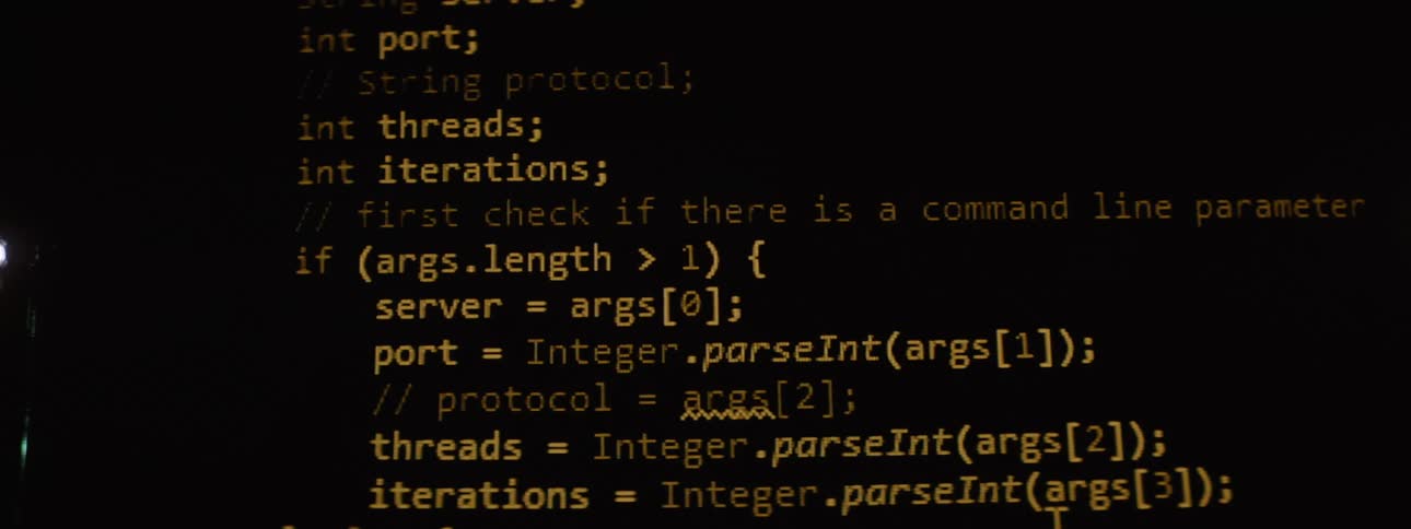 Computer code flashes on the screen