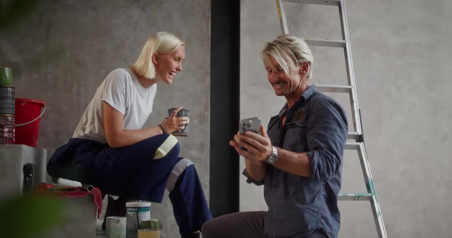 Man and woman on a staircase interacting with laughter